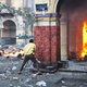 A civilian takes cover during clashes with security officers in Cairo. (Virginie Nguyen Hoang/AFP/Getty Images)